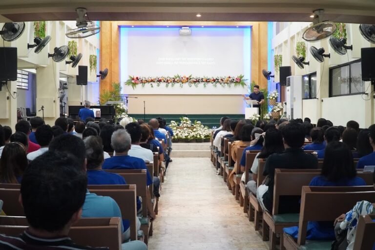 The congregation listening to a sermon from the pulpit