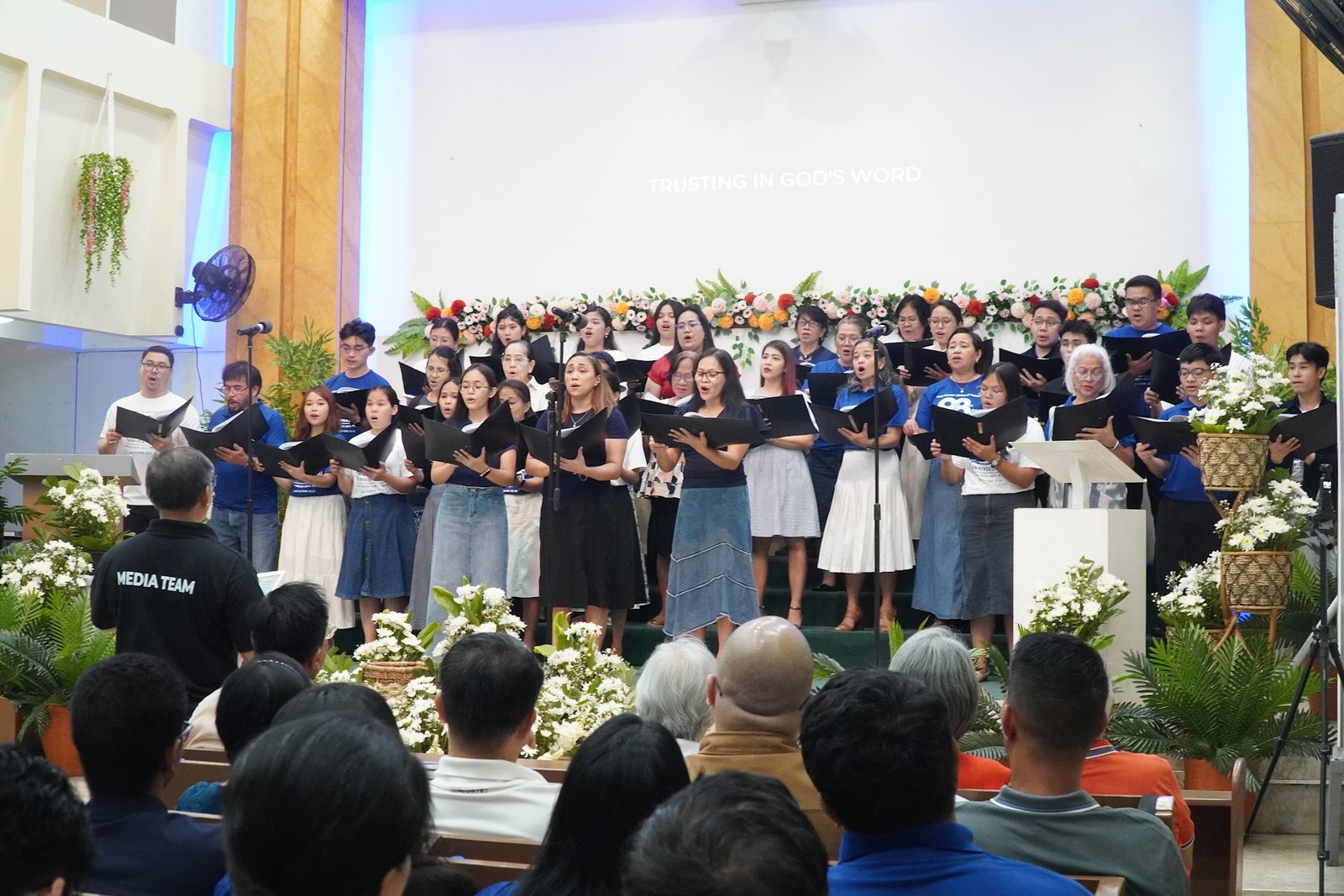 The choir and congregation singing during worship